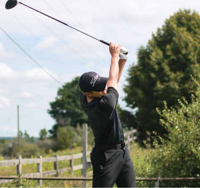 Ferris professional golf management sophomore Ben Strong eyes his drive during Ferris’ open golf tryouts. Several talented golfers
showed up to Katke Golf Course over Labor Day weekend in hopes of fighting their way onto the Bulldog squad.