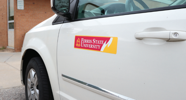 Ferris vehicles can be seen driving on sidewalks and parked in front of buildings all around campus.