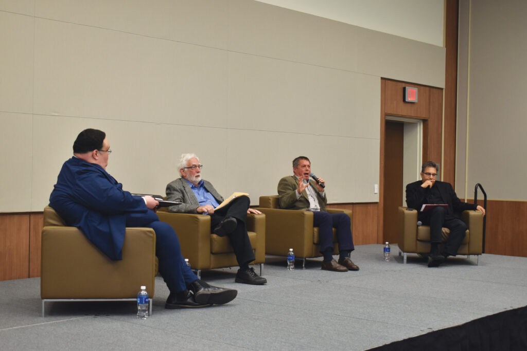 Professors David Takitaki, Ron Stockton, Howard Lupovitch and Saeed Khan discussing the political complications of the Israeli-Palestinian conflict during the panel on Tuesday. 