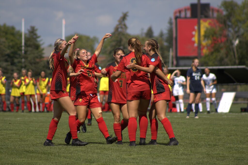 The Ferris State women’s soccer team celebrates after defeating the Northwoods Timberwolves 3-1.
