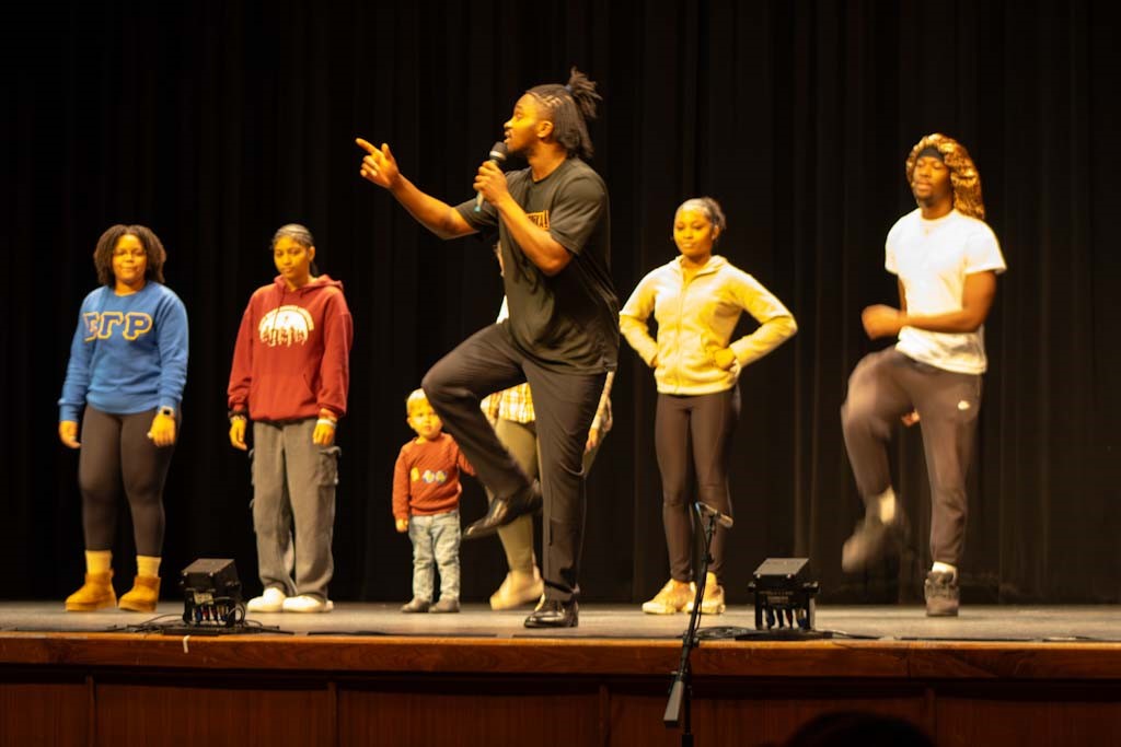 Step Afrika! invites students and community members onto the stage to learn some steps.
