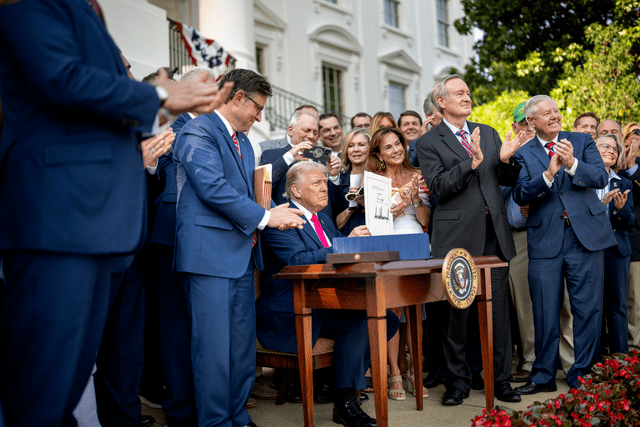 Donald Trump signing the Big Beautiful Bill.