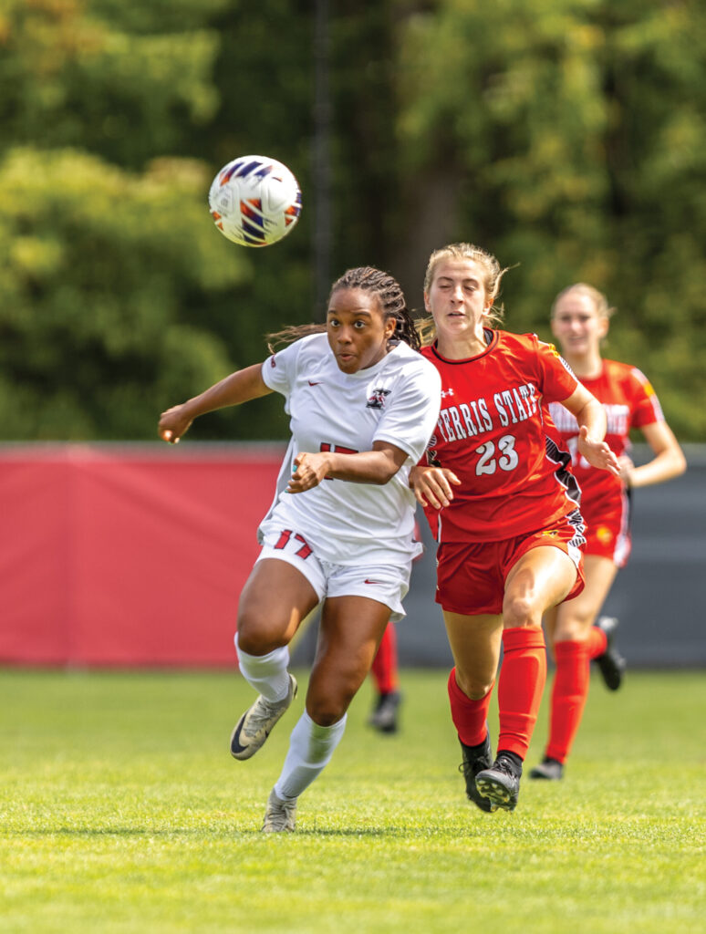 Katherine Welch (right) battles a defender.