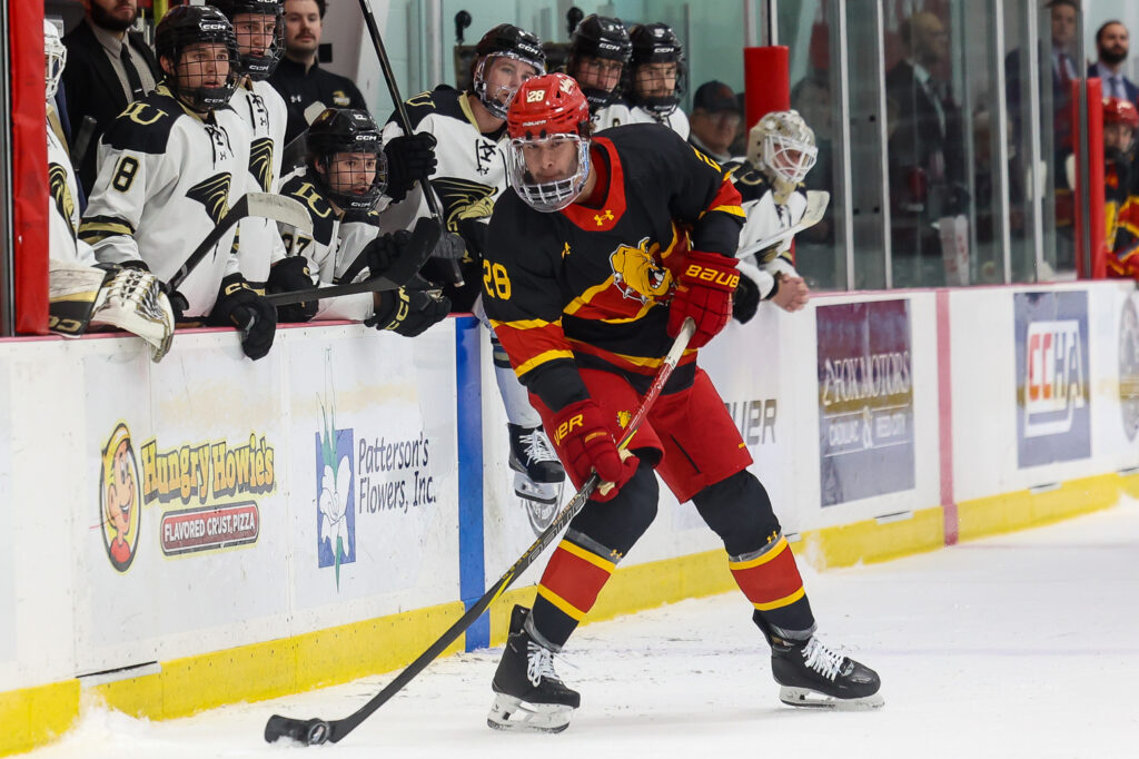 Junior defenseman Trevor Taulien handles the puck against Augustana in 2025.