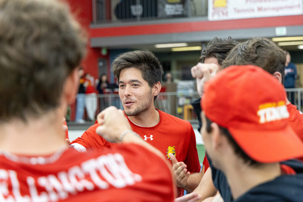 Senior Erik Kovacs talks with his team after the final match of the season.