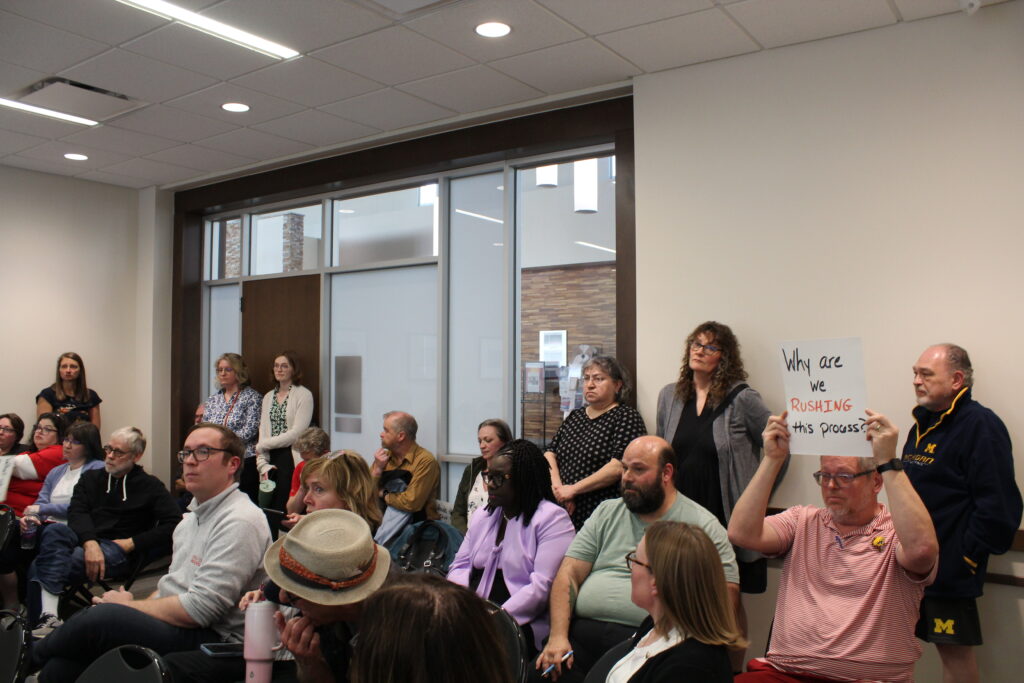Faculty members attending one of the town hall meetings to ensure their voices are heard.